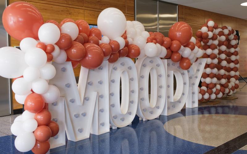 moody sign with balloons