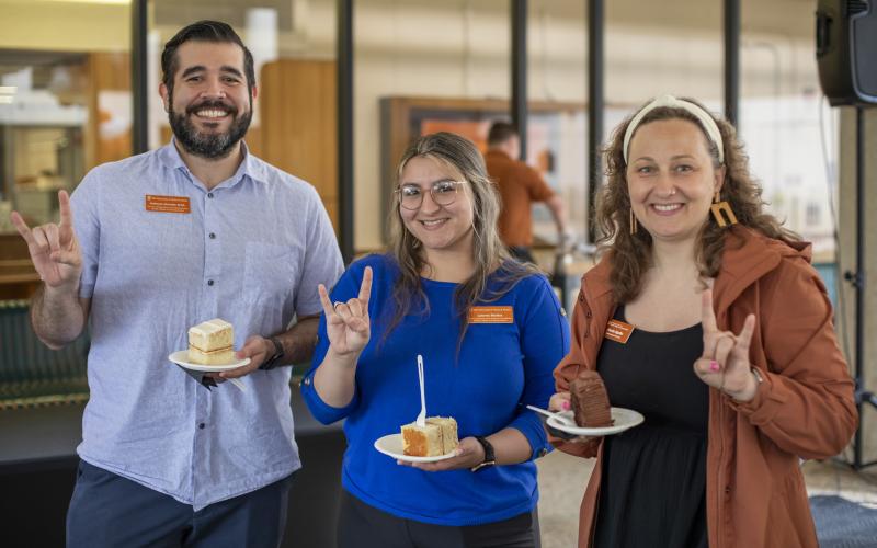 People eating cake at outside reception