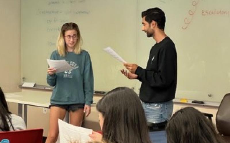 Two students act out a conflict resolution scene