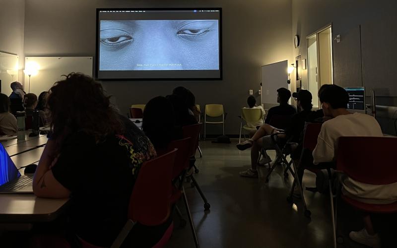 Image depicts students watching a film.