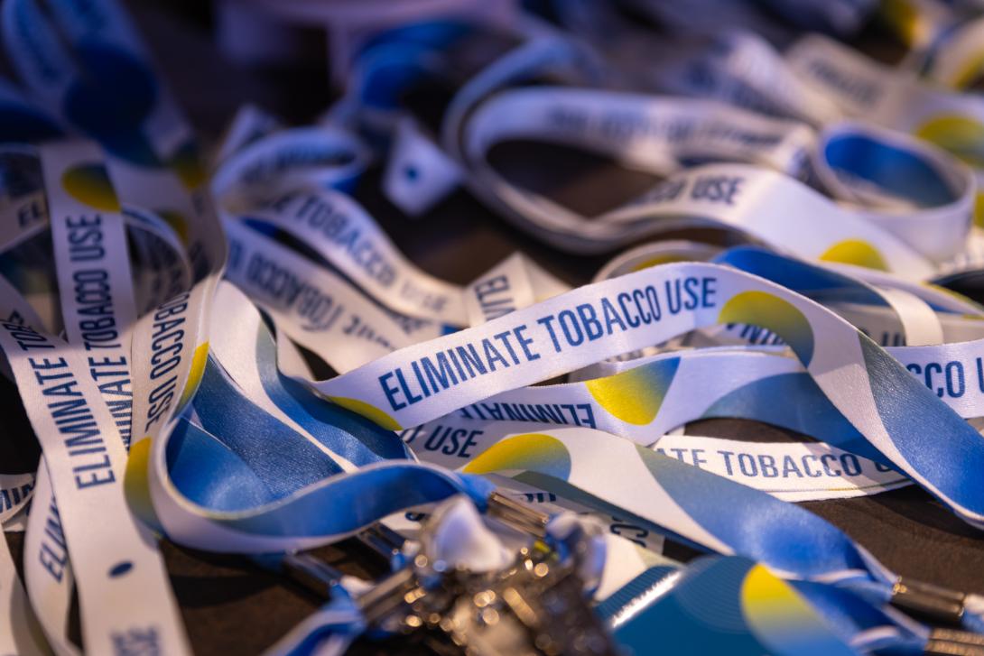 close up of lanyards with text that says eliminate tobacco use